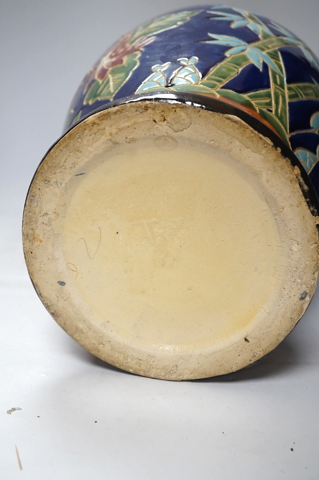 A South East Asian polychrome pottery vase and a Staffordshire pottery greyhound pen holder, vase 53cm high. Condition - vase fair, pen holder marks to glazing